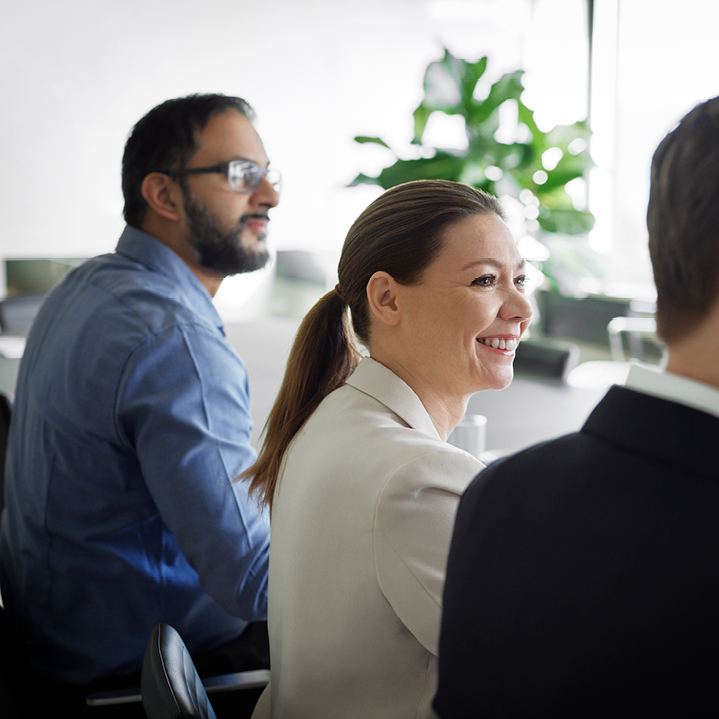 DB Web Woman In Meeting Fiftyfifty Office 719X719px